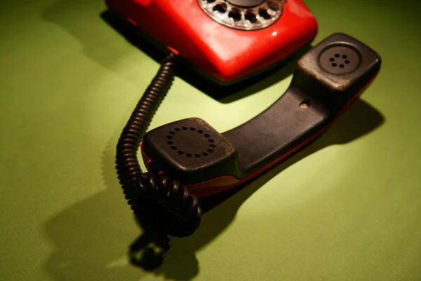 Red retro telephone on dark color background — Stock Photo, Image