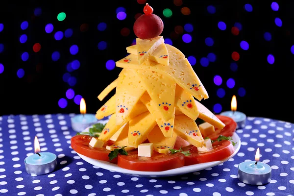 Christmas tree from cheese on table on dark background — Stock Photo, Image