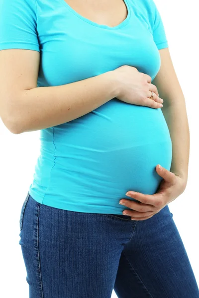 Zwangere vrouw aan haar buik op wit wordt geïsoleerd te raken — Stockfoto