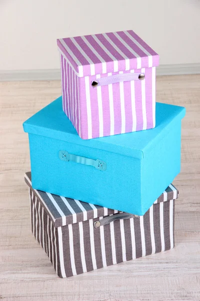 Textile boxes on floor in room — Stock Photo, Image