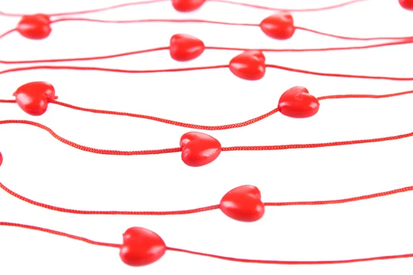 Contas em forma de coração na corda isolada no branco — Fotografia de Stock
