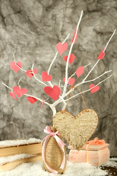 Decorative branch with hearts, on grey background — Stock Photo, Image