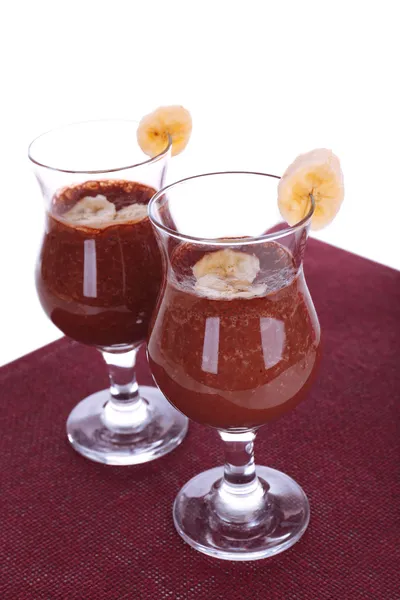 Cocktails with banana and chocolate on table on white background — Stock Photo, Image