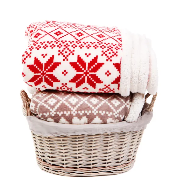 Warm plaids in basket isolated on white — Stock Photo, Image