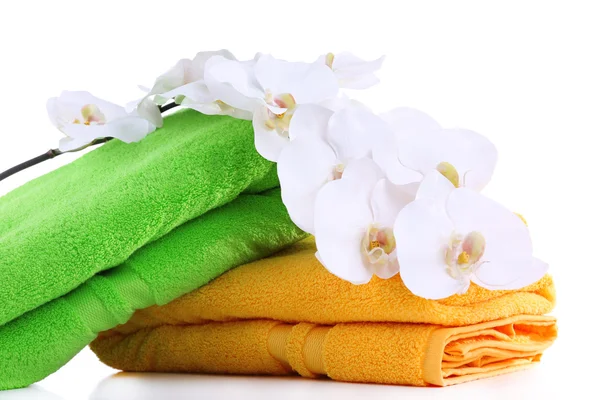 Colorful towels and flowers, isolated on white Royalty Free Stock Photos