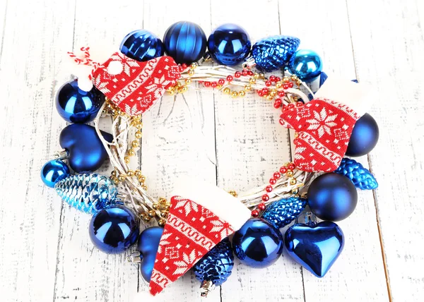 Christmas wreath of colorful balls on wooden table close-up — Stock Photo, Image