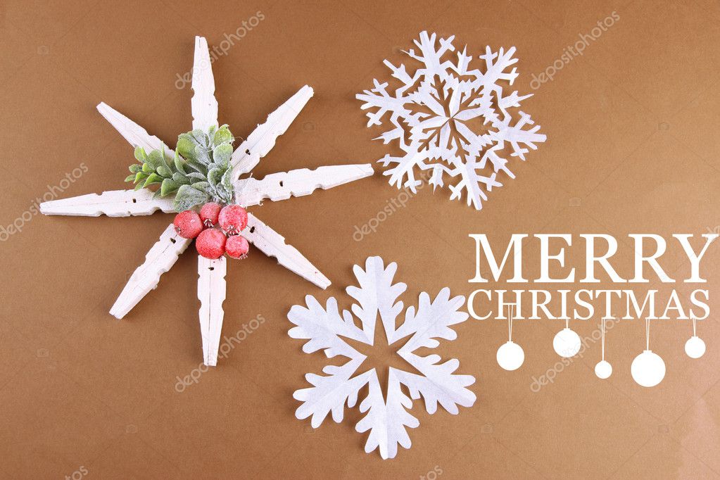 Beautiful snowflakes on brown background