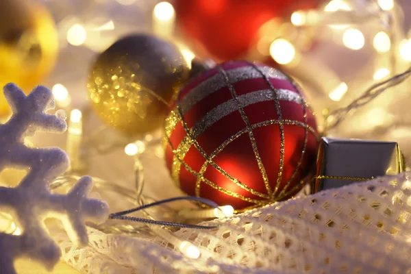 Christmas ornaments and garland on bright background close-up — Stock Photo, Image