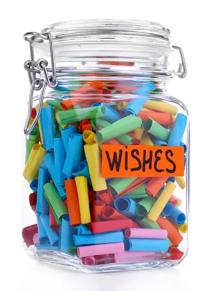 Dreams written on color rolled paper in glass jar, isolated on white — Stock Photo, Image