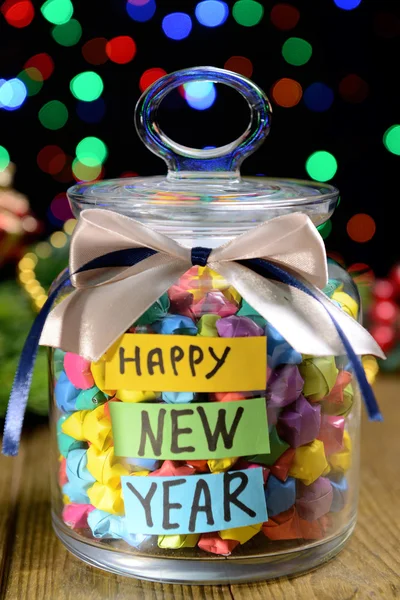 Paper stars with dreams on table on dark background — Stock Photo, Image