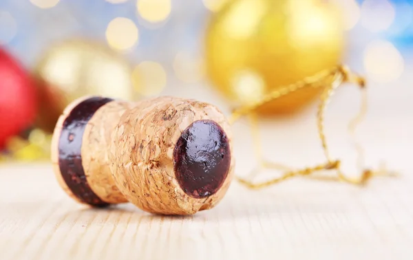Champagne cork on Christmas lights background — Stock Photo, Image