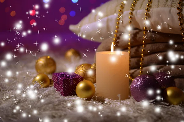 Composition with plaids, candles and Christmas decorations, on white carpet on bright background — Stock Photo, Image