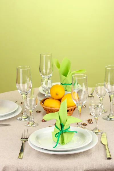 Table setting in green and yellow tones on color background — Stock Photo, Image