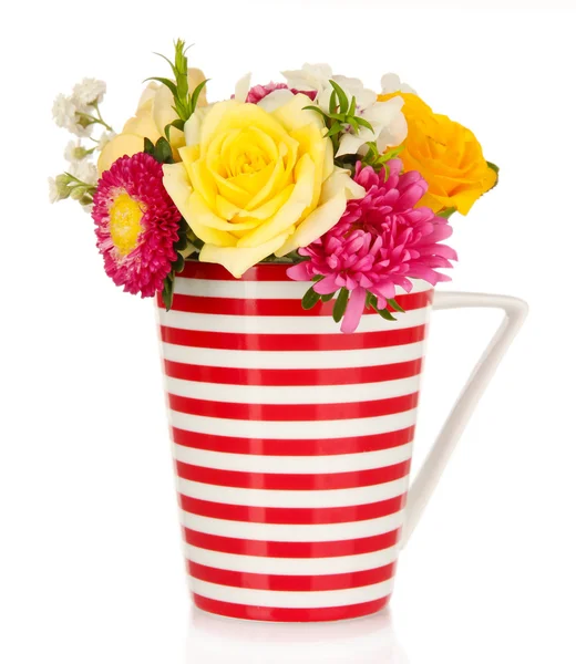 Beautiful bouquet of bright flowers in color mug, isolated on white — Stock Photo, Image