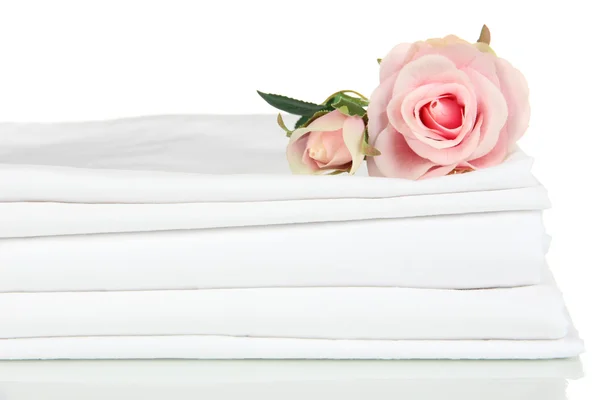 Stack of clean bedding sheets isolated on white — Stock Photo, Image