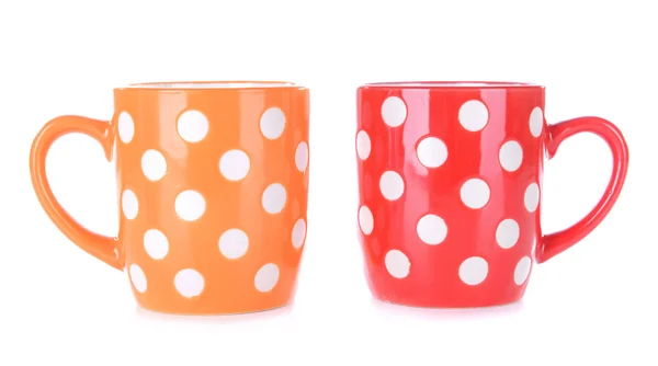 Color polka dot mugs isolated on white — Stock Photo, Image