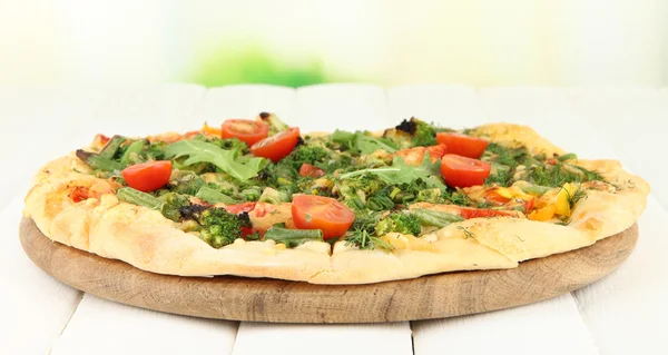 Tasty vegetarian pizza on wooden table — Stock Photo, Image