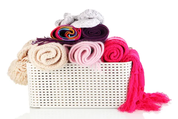 Plastic basket with scarves isolated on white — Stock Photo, Image