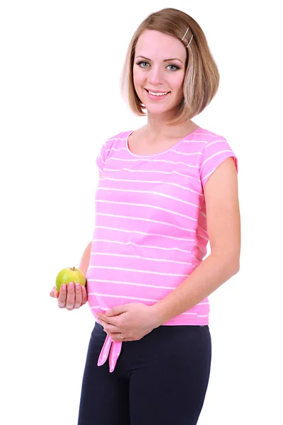 Jonge zwangere vrouw met groene appel geïsoleerd op wit — Stockfoto