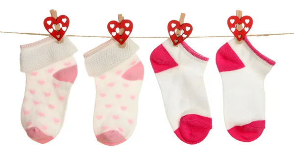 Socks hanging on clothesline isolated on white — Stock Photo, Image