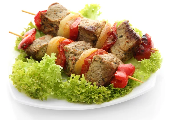 Tasty grilled meat and vegetables on skewers on plate, isoalted on white — Stock Photo, Image