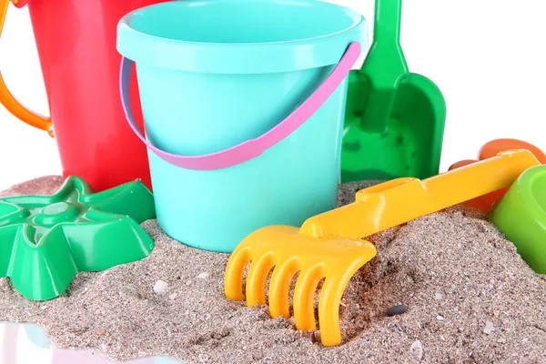 Children's toys on sand isolated on white — Stock Photo, Image