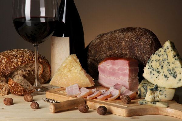 Exquisite still life of wine, cheese and meat products