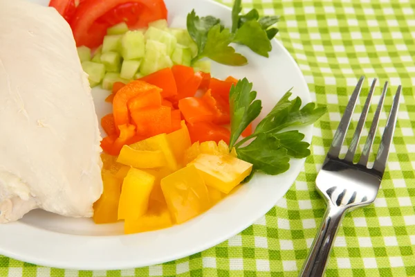 Boiled chicken breast on plate with vegetables close up — Stock Photo, Image