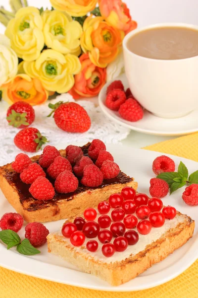 Delicious toast with berries on table close-up — Stock Photo, Image