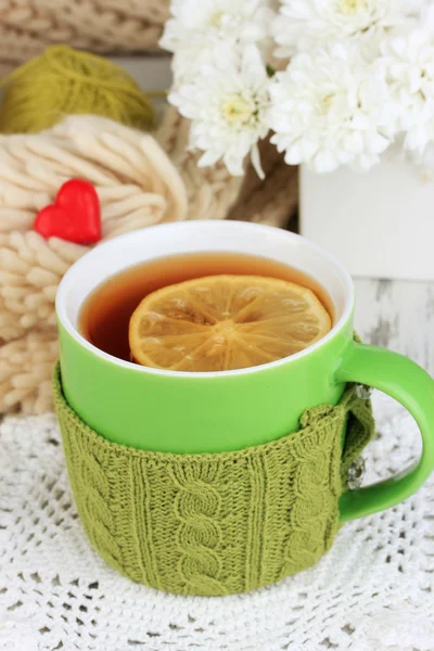 Cup with knitted thing on it close up — Stock Photo, Image