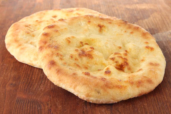 Pita breads on wooden background — Stock Photo, Image