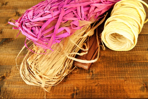 Decorative straw for hand made, on wooden background