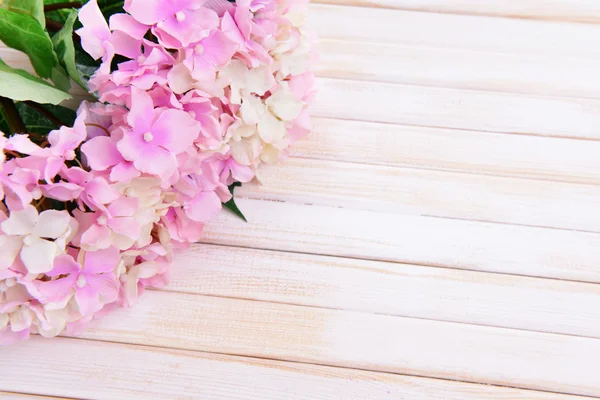 Bukett med vackra konstgjorda blommor, på färg trä bakgrund — Stockfoto