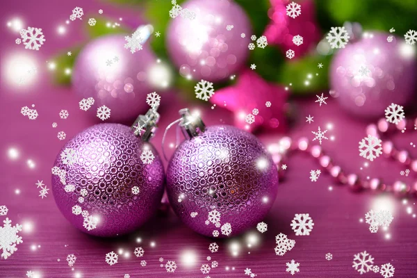 Christmas balls on fir tree, on color background Stock Image