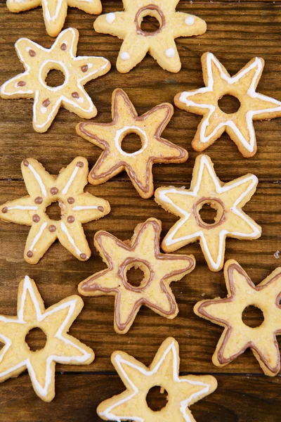 Delicious Christmas cookies on wooden background — Stock Photo, Image