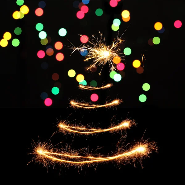 Sparklers in Christmas tree-shaped — Stock Photo, Image