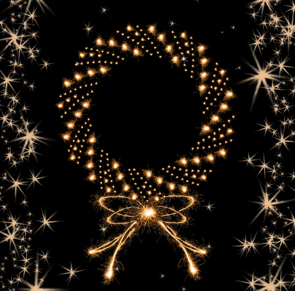 Christmas sparklers in shape of Christmas wreath on black background — Stock Photo, Image