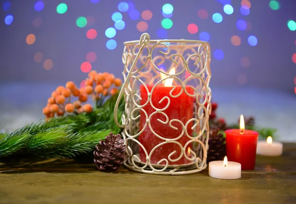 Candles and Christmas decoration on bright background — Stock Photo, Image