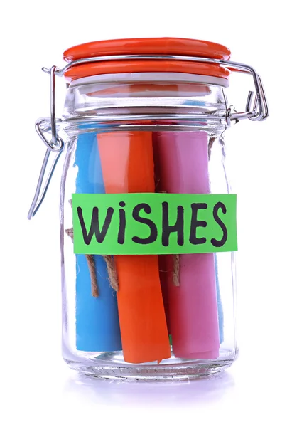 Dreams written on color rolled paper in glass jar, isolated on white — Stock Photo, Image