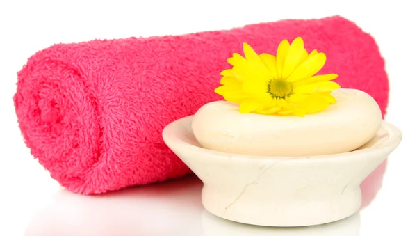 Rolled pink towel, soap bar and beautiful flower isolated on white — Stock Photo, Image