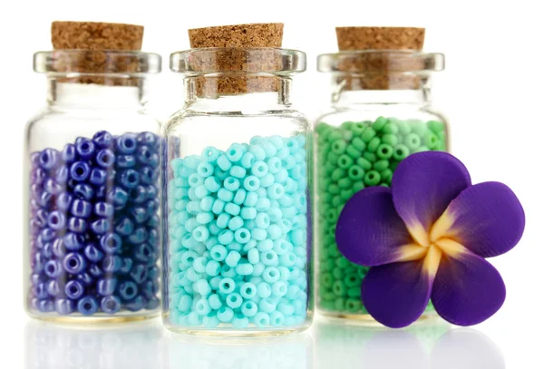 Little bottles full with colorful beads isolated on white — Stock Photo, Image