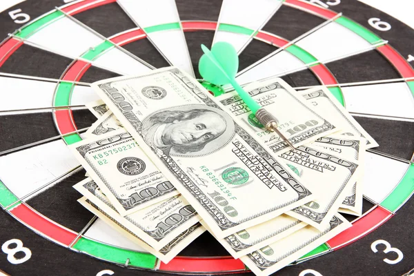 Dart on dartboard and money close up. Concept of success. — Stock Photo, Image