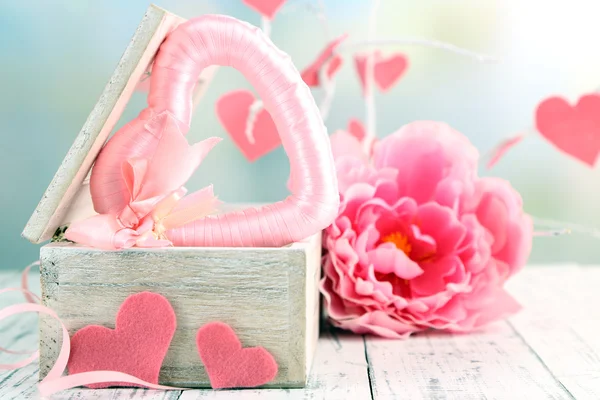 Romantic still life with heart in wooden casket — Stock Photo, Image