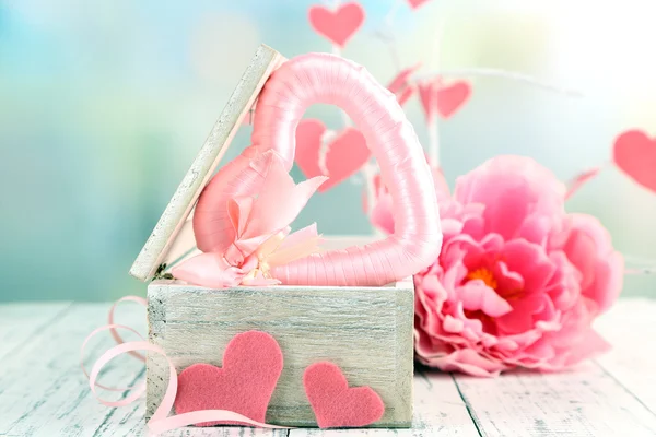 Romantic still life with heart in wooden casket — Stock Photo, Image