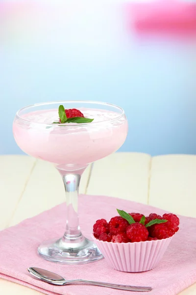 Raspberry milk dessert in cocktail glass, on light background — Stok Foto