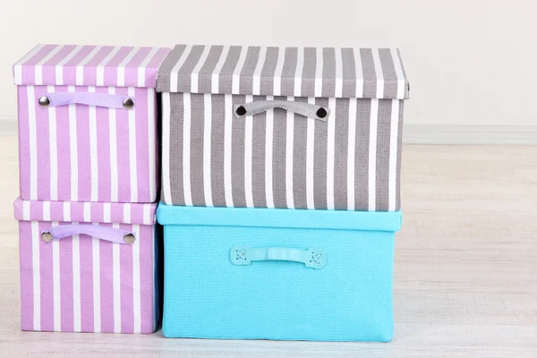 Textile boxes on floor in room — Stock Photo, Image