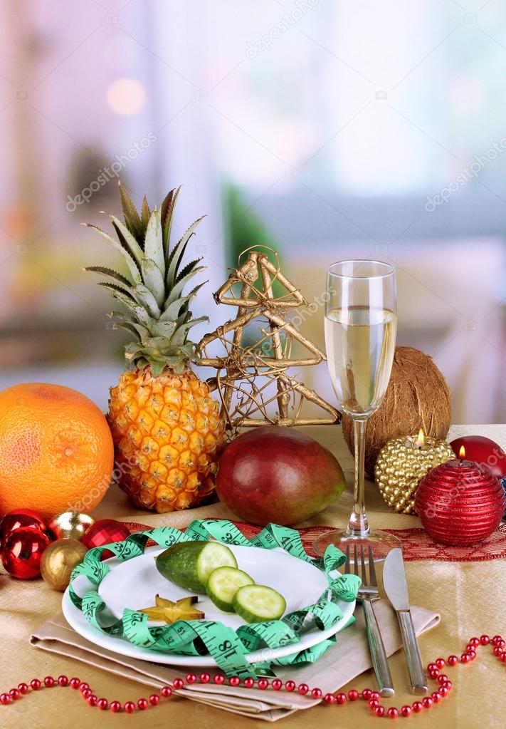 Dietary food on New Year's table on room background