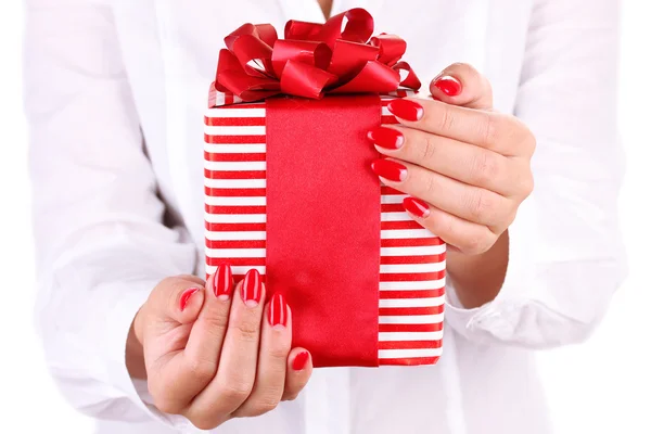 Woman holds box with gift on white background close-up — Stockfoto