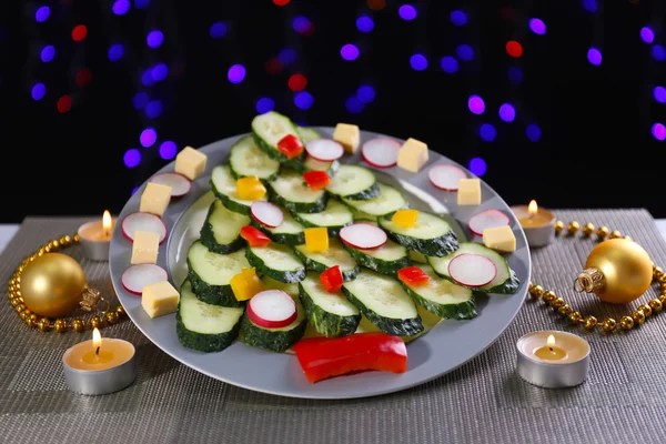 Christmas tree from cucumber on plate on table on dark background — Stock Photo, Image
