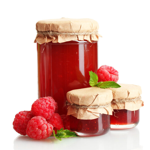 jars with jam and ripe raspberries with mint isolated on white
